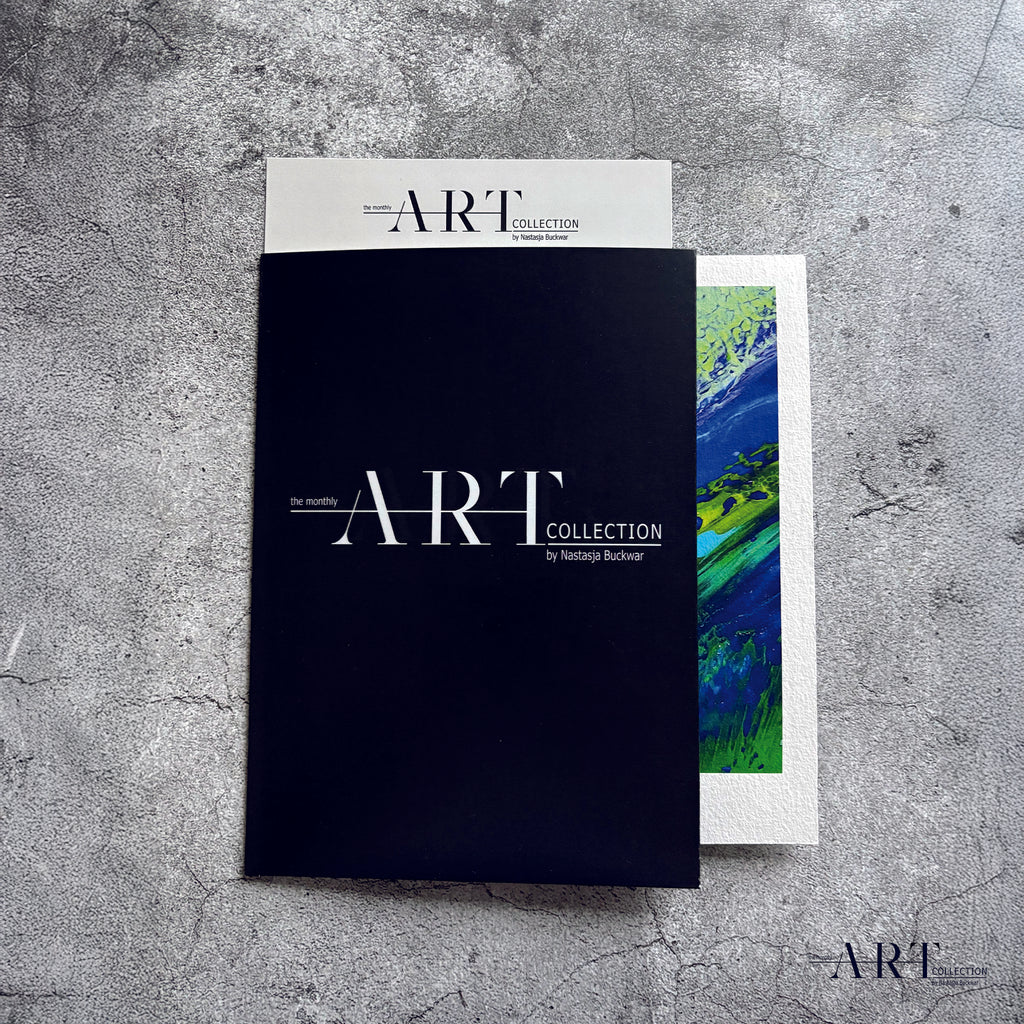 Open black ART COLLECTION portfolio showing the art print inside on grey concrete background.