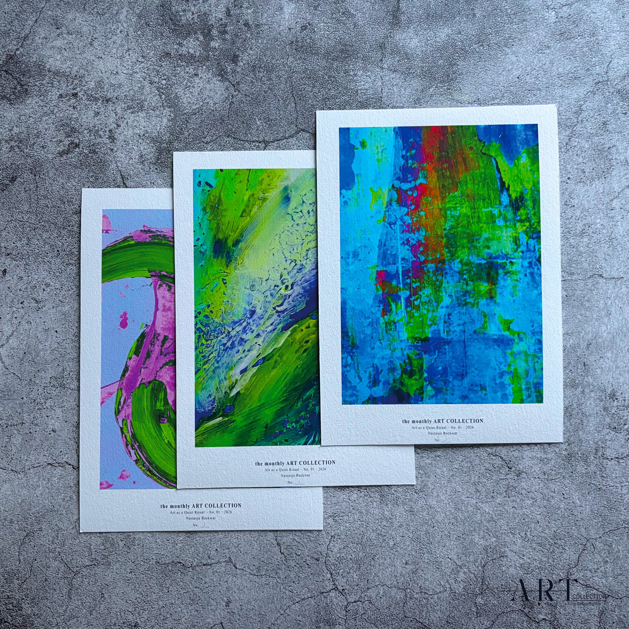 Set of three art prints arranged as a series on grey concrete background.